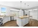 Charming kitchen featuring stainless appliances, granite countertops, and an eat-in island at 3574 Johnson Grant Dr, New Hill, NC 27562