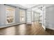 Open living space featuring large windows and French doors leading into the foyer at 3574 Johnson Grant Dr, New Hill, NC 27562
