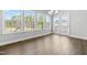 Sunroom with many windows, neutral walls, and views of the backyard's play set at 3574 Johnson Grant Dr, New Hill, NC 27562