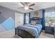Comfortable bedroom with ceiling fan, mountain decor, and natural light at 3727 Horton Hill Dr, New Hill, NC 27562
