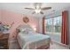 Bedroom featuring neutral tones, ceiling fan, and natural light at 3727 Horton Hill Dr, New Hill, NC 27562