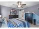 Cozy bedroom featuring neutral tones, with black dressers and mountain decor at 3727 Horton Hill Dr, New Hill, NC 27562