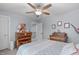 Bright bedroom featuring two dressers, ceiling fan, and soft, neutral tones at 3727 Horton Hill Dr, New Hill, NC 27562
