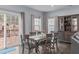Charming dining room featuring a wooden table with seating for six and sliding glass door to backyard at 3727 Horton Hill Dr, New Hill, NC 27562