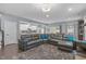 Open concept living area showcasing a large sofa, seamlessly connected to the adjacent kitchen at 3727 Horton Hill Dr, New Hill, NC 27562