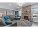 Inviting living room featuring a stone fireplace, plush seating, and lots of natural light at 3727 Horton Hill Dr, New Hill, NC 27562