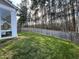 Beautiful backyard with a green lawn, tall trees, and a hammock for relaxation at 4000 Passenger Pl, Durham, NC 27703