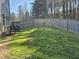 Large backyard with a grassy lawn and a hammock, perfect for outdoor relaxation at 4000 Passenger Pl, Durham, NC 27703