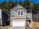 Charming two-story home featuring a two-car garage and a well-manicured front lawn at 4000 Passenger Pl, Durham, NC 27703