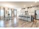 Open-concept kitchen and dining area featuring an island with seating, stainless appliances, and modern finishes at 4000 Passenger Pl, Durham, NC 27703