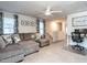Upstairs living room with carpet, comfortable seating, and a desk setup at 4000 Passenger Pl, Durham, NC 27703