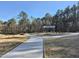 Community path leading to a pavilion with picnic tables surrounded by mature trees at 4000 Passenger Pl, Durham, NC 27703