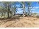 Spacious backyard featuring mature trees offering ample shade and privacy for outdoor enjoyment at 417 Baker St, Nashville, NC 27856