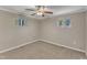 Inviting bedroom featuring a ceiling fan and two windows, offering natural light and comfort at 417 Baker St, Nashville, NC 27856
