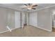 Inviting bedroom featuring a ceiling fan, large closet, and convenient access to the ensuite bathroom at 417 Baker St, Nashville, NC 27856