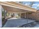 Attached covered carport provides protection from the elements at 417 Baker St, Nashville, NC 27856