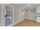 Light-filled dining area with a stylish pendant light and views of the outdoors at 417 Baker St, Nashville, NC 27856
