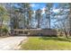 Charming brick home featuring a covered carport and front yard at 417 Baker St, Nashville, NC 27856