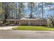 Charming brick home featuring a covered carport and front yard at 417 Baker St, Nashville, NC 27856