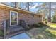 Charming front entrance with brick steps and landscaped bushes at 417 Baker St, Nashville, NC 27856
