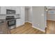 Well-equipped kitchen featuring stainless steel appliances and dark butcher block countertops, complemented by wood-look floors at 417 Baker St, Nashville, NC 27856