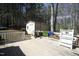View of wooden back deck and storage shed nestled among mature trees providing privacy at 4336 N Greg Allen Way, Oxford, NC 27565