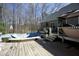 Back deck next to an above ground pool needing repair in the tree covered back yard at 4336 N Greg Allen Way, Oxford, NC 27565