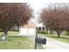 Inviting home exterior with a well-manicured lawn and blossoming trees in the front yard at 4336 N Greg Allen Way, Oxford, NC 27565