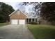 Charming brick and siding home with a two-car garage and covered front porch at 4336 N Greg Allen Way, Oxford, NC 27565