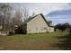 Exterior view of house with vinyl siding, back deck, and grassy yard at 4336 N Greg Allen Way, Oxford, NC 27565