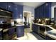 Modern kitchen with stainless steel appliances and blue cabinets at 4336 N Greg Allen Way, Oxford, NC 27565