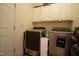 Functional laundry room with modern washer and dryer and built-in cabinets at 4336 N Greg Allen Way, Oxford, NC 27565