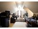 Living room in attic with plush seating, storage, and natural light from the window at 4336 N Greg Allen Way, Oxford, NC 27565