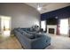Comfortable living room with a fireplace, large sectional sofa, and neutral color palette at 4336 N Greg Allen Way, Oxford, NC 27565