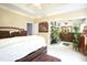 A cozy bedroom with soft inviting decor and an open en-suite bathroom at 4336 N Greg Allen Way, Oxford, NC 27565