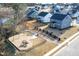 Aerial view of a neighborhood with a playground and sidewalks at 505 Marion Hills Way, Knightdale, NC 27545