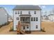 Back exterior view with a screened porch, a backyard deck, and stairs to the basement at 505 Marion Hills Way, Knightdale, NC 27545