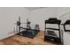 Well-equipped home gym features a treadmill, weights, bench, and mirrors for a complete workout space at 505 Marion Hills Way, Knightdale, NC 27545