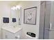 Modern bathroom featuring a sleek vanity, framed art, and a glass-enclosed shower at 505 Marion Hills Way, Knightdale, NC 27545