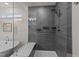 Glass enclosed shower features gray tiled walls and a modern showerhead at 505 Marion Hills Way, Knightdale, NC 27545