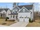 Beautiful two-story home with covered porch, gray accents, and an attached two-car garage at 505 Marion Hills Way, Knightdale, NC 27545