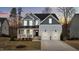 Charming two-story home featuring a welcoming front porch and a two-car garage at 505 Marion Hills Way, Knightdale, NC 27545