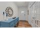 Bright entryway with hardwood floors, blue console table, and decorative mirror at 505 Marion Hills Way, Knightdale, NC 27545