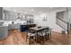 Spacious kitchen connected to dining area, featuring stainless steel appliances and a large center island at 505 Marion Hills Way, Knightdale, NC 27545