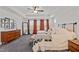 Bright main bedroom features modern decor, trey ceilings and comfortable carpet at 505 Marion Hills Way, Knightdale, NC 27545