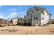 Spacious backyard features a house with a porch and an early spring bloom at 518 Parlier Dr # 82, Apex, NC 27523