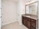 Bathroom featuring granite countertop, brushed nickel faucet, and storage cabinet at 518 Parlier Dr # 82, Apex, NC 27523