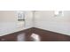 Elegant dining room with hardwood floors, wainscoting, and natural light from large windows at 518 Parlier Dr # 82, Apex, NC 27523