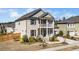 Charming two-story home with a cozy front porch and well-manicured lawn at 518 Parlier Dr # 82, Apex, NC 27523