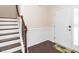 Bright foyer featuring a staircase, paneled walls, and a decorative front door at 518 Parlier Dr # 82, Apex, NC 27523